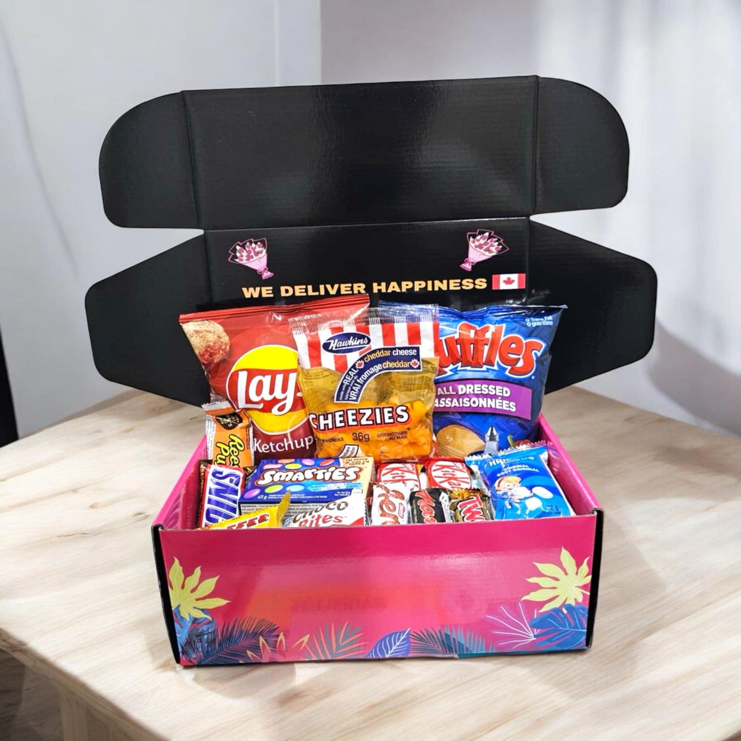 Canadian snack gift box consists of lays ketchup chips, ruffles all dressed, smarties